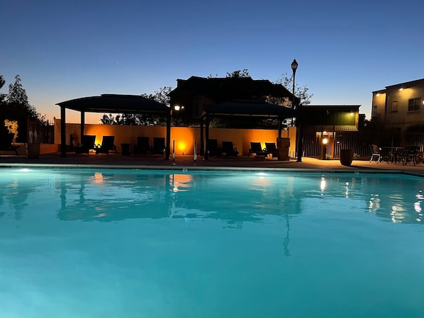 Outdoor pool, open 7:00 AM to 10:00 PM, pool loungers