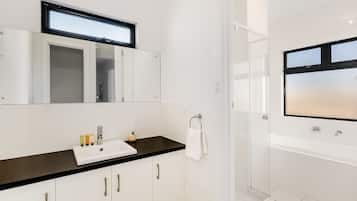 Bathtub, hair dryer, towels