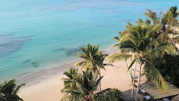 On the beach, sun-loungers, beach towels