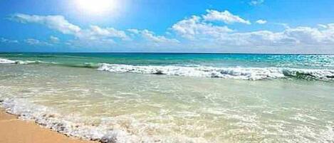 On the beach, sun-loungers, beach towels