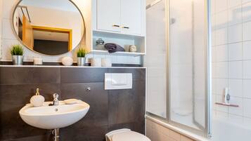 Bathtub, hair dryer, towels, soap