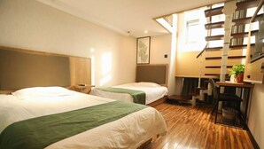 A hotel room with two beds, a desk, a chair, a staircase, and a window. - Greentree Inn Hefei Fanhua Avenue Juece Building B (Hefei)