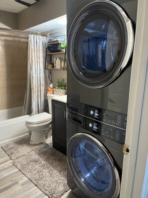 Combined shower/bathtub, hair dryer, towels, soap