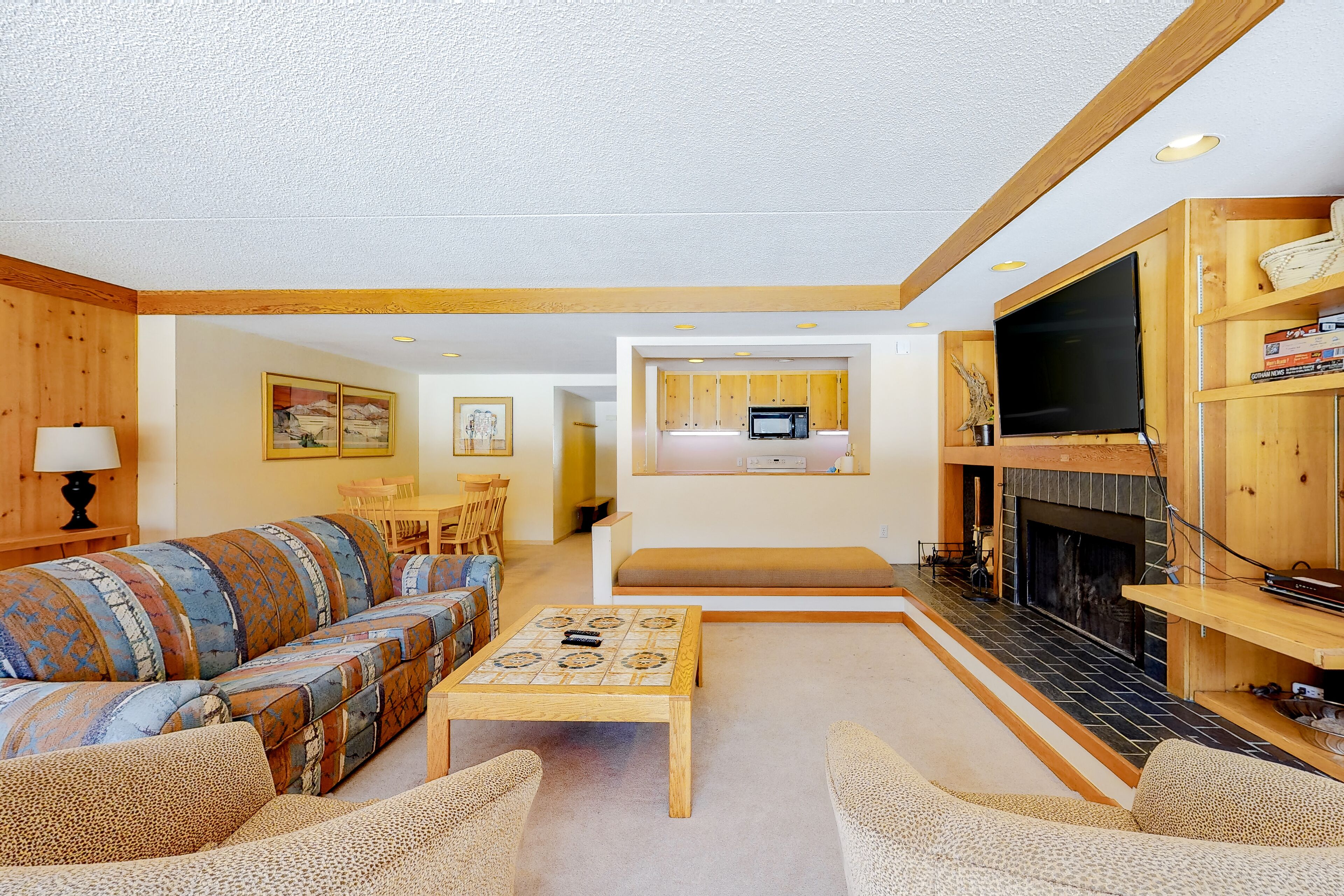 Mountain-view condo w/ wood fireplace, WiFi & shared heated pool, hot tub, W/D