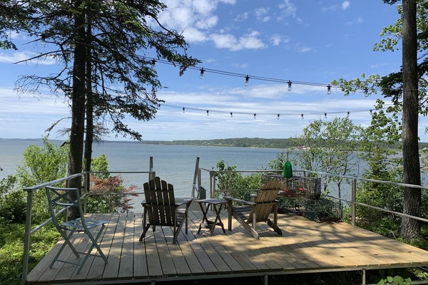 One of 3 deck areas overlooking the bay; Stairs leading to private bay access