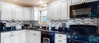 Wonderful three-story home with lovely decks, firepit, fast WiFi & washer/dryer