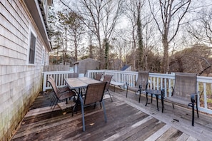 Enjoy outdoor dining or relaxation on the deck with a table and chairs.