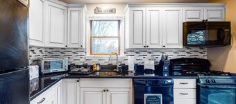 Wonderful three-story home with lovely decks, firepit, fast WiFi & washer/dryer