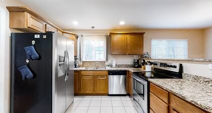 Riverfront gem w/wraparound deck, horseshoes, firepit, hot tub, WiFi - 2 dogs OK