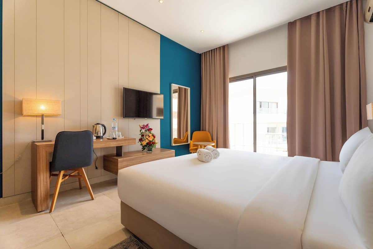 Standaard kamer | Luxe beddengoed, een minibar, een kluis op de kamer, geluiddichte muren