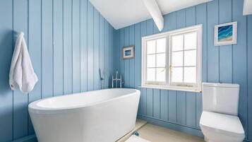 Bathtub, hair dryer, towels
