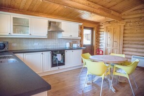 Chalet (1 Bedroom) | Private kitchen | Oven, stovetop, cookware/dishes/utensils - Willow Lodge With Hot Tub, Kingfishers (Woodbridge)