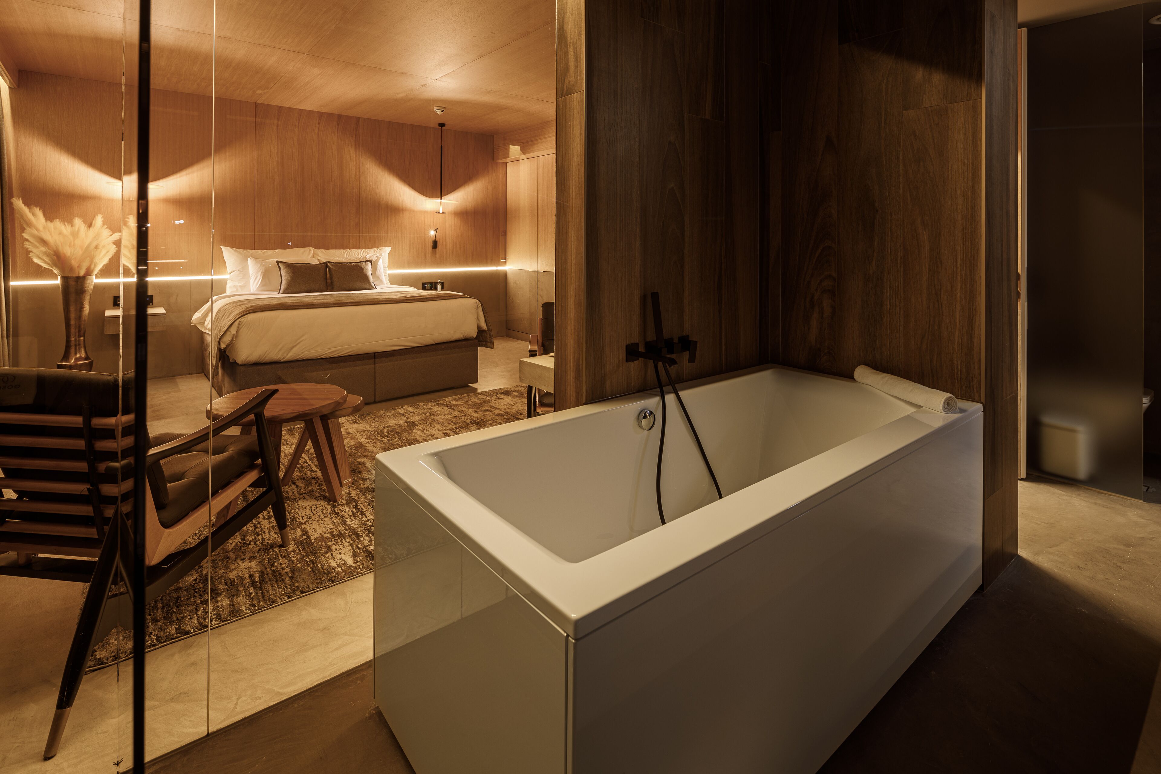 signature junior suite | bathroom | bathtub, free toiletries, hair dryer, bathrobes