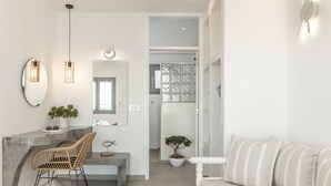 Poseidonas Suite | Living area | 32-inch Smart TV with cable channels, TV - La Estrella Luxury Suites (Santorini)