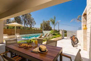 Shaded dining area next to the pool!