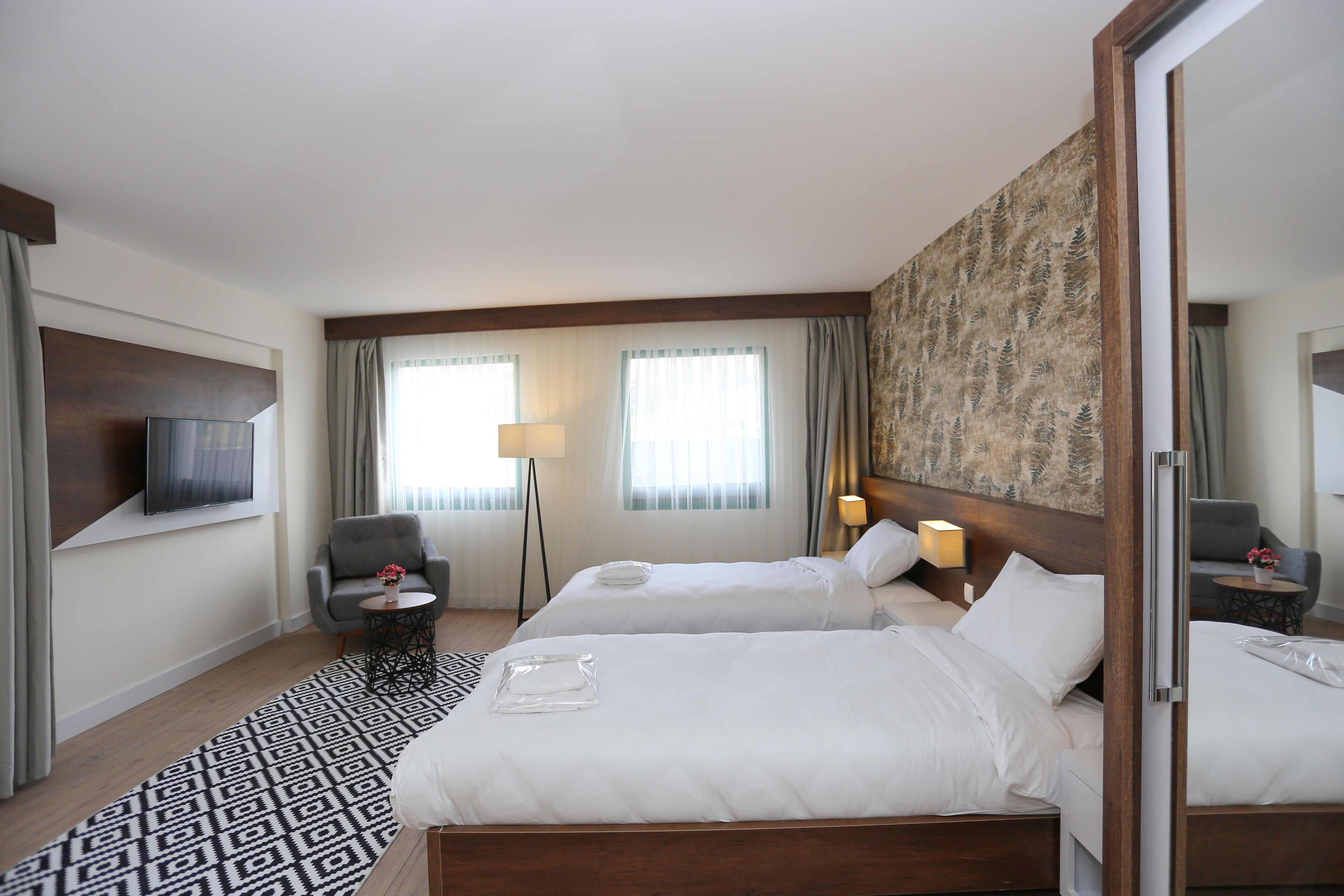 deluxe twin room | premium bedding, minibar, desk, laptop workspace