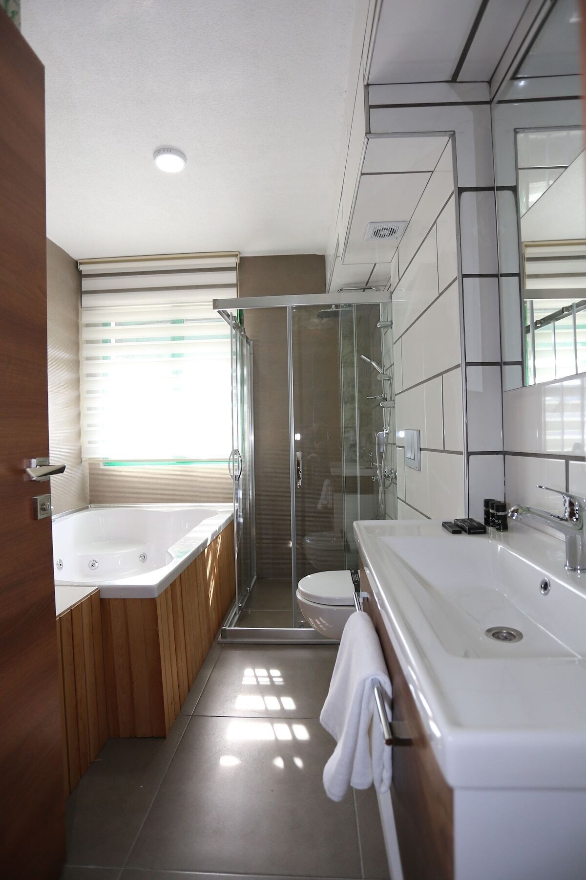 junior double room | bathroom | rainfall showerhead, free toiletries, hair dryer, bathrobes
