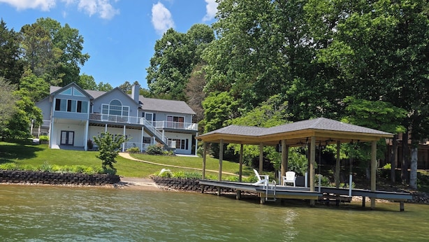 A lakeside property with a house, a dock, and a gazebo. - Amazing! Tellico village lake house with dock! (Loudon)