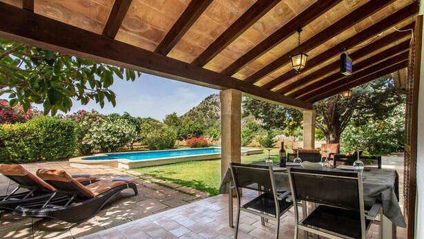 An outdoor patio with a pool, lounge chairs, and a barbecue area. - Villa Sol Roma, 3 bedrooms villa  with pool near Pollensa (Pollença)