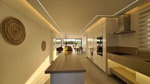 Deluxe Villa | Living area | 75-inch flat-screen TV with cable channels, Smart TV - Phaedrus Living: Venus Seaview Lighthouse Villa (Paphos)