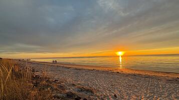 On the beach, sun-loungers, beach towels