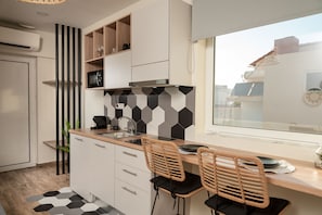 Fridge, cookware/dishes/utensils, dining tables