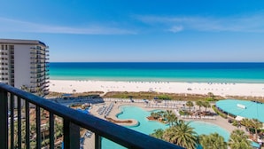 A resort with a pool area, beach, and ocean view. - Hello Sunshine Edgewater, Tower 1, #905-Beachfront! 2Bd-2Ba-Sleeps 6-Fun In The Sun! (Panama City Beach)