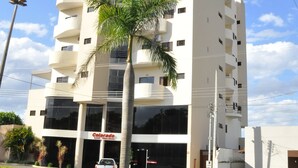 A multi-story building with a modern design, featuring balconies and large windows. - Hotel Colorado (Rio Verde)