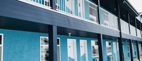 A two-story building with a blue exterior and white trim.