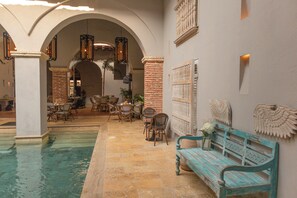 Outdoor pool, open 9:00 AM to 6:00 PM, sun loungers