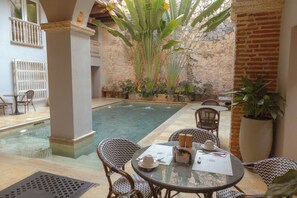 Outdoor pool, open 9:00 AM to 6:00 PM, sun loungers