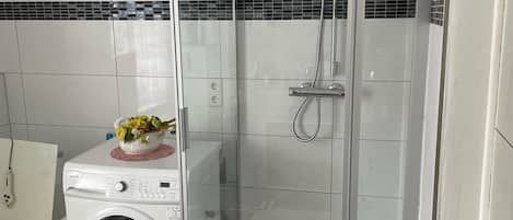 Bathtub, hair dryer, towels, soap