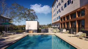 Outdoor pool, open 6:00 AM to 11:00 PM, pool umbrellas, sun loungers