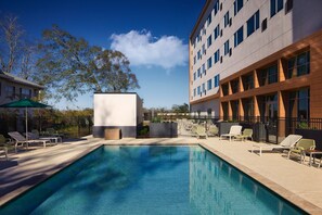 Outdoor pool, open 6:00 AM to 11:00 PM, pool umbrellas, pool loungers