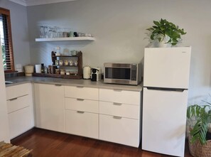 Coffee/tea maker, fridge, microwave, oven