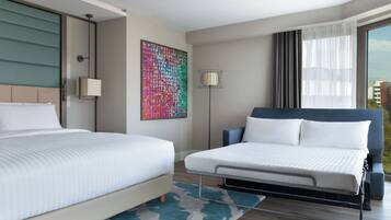 A modern hotel room with two beds, a large window with curtains, a colorful abstract painting, and a floor lamp.