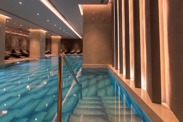 Indoor pool, seasonal outdoor pool, pool umbrellas, pool loungers