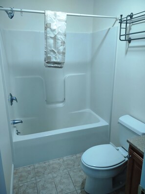 Combined shower/bathtub, hair dryer, towels, soap