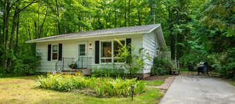 Retreat on a wooded lot within walking distance of downtown!