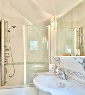 Shower, hair dryer, towels, soap