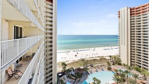 A high-rise hotel with a pool, beach view, and multiple balconies. - 1322 Pool & Beach views, w/2 parking passes, lagoon-style pool & indoor pool (Panama City Beach)