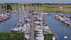 A marina with numerous boats docked in a structured layout. - Apartment in Veere With Lake Views & Marina (Kamperland)
