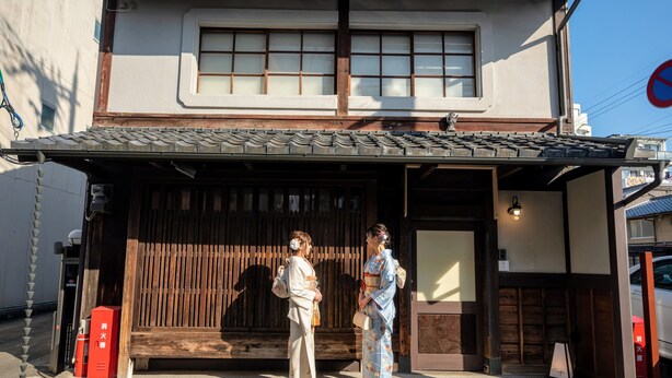 A traditional Japanese building with a wooden exterior and a tiled roof. - Campton Higashiyama Roku (Kyoto)