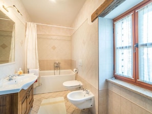 Bathtub, hair dryer, towels