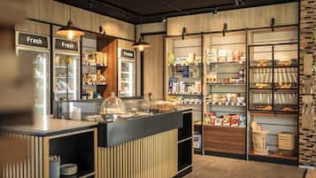 A bakery counter with a display case and a refrigerated section labeled 'Fresh' and 'Freeze'.