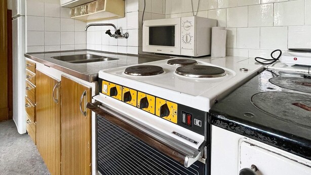 A kitchen with a stove, microwave, and sink. - 5 Person Holiday Home in Linneryd/kronobergs Lan (Linneryd)