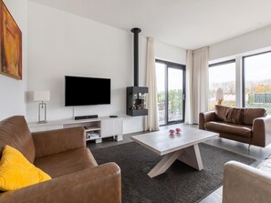 Villa | Sala de estar | Una chimenea