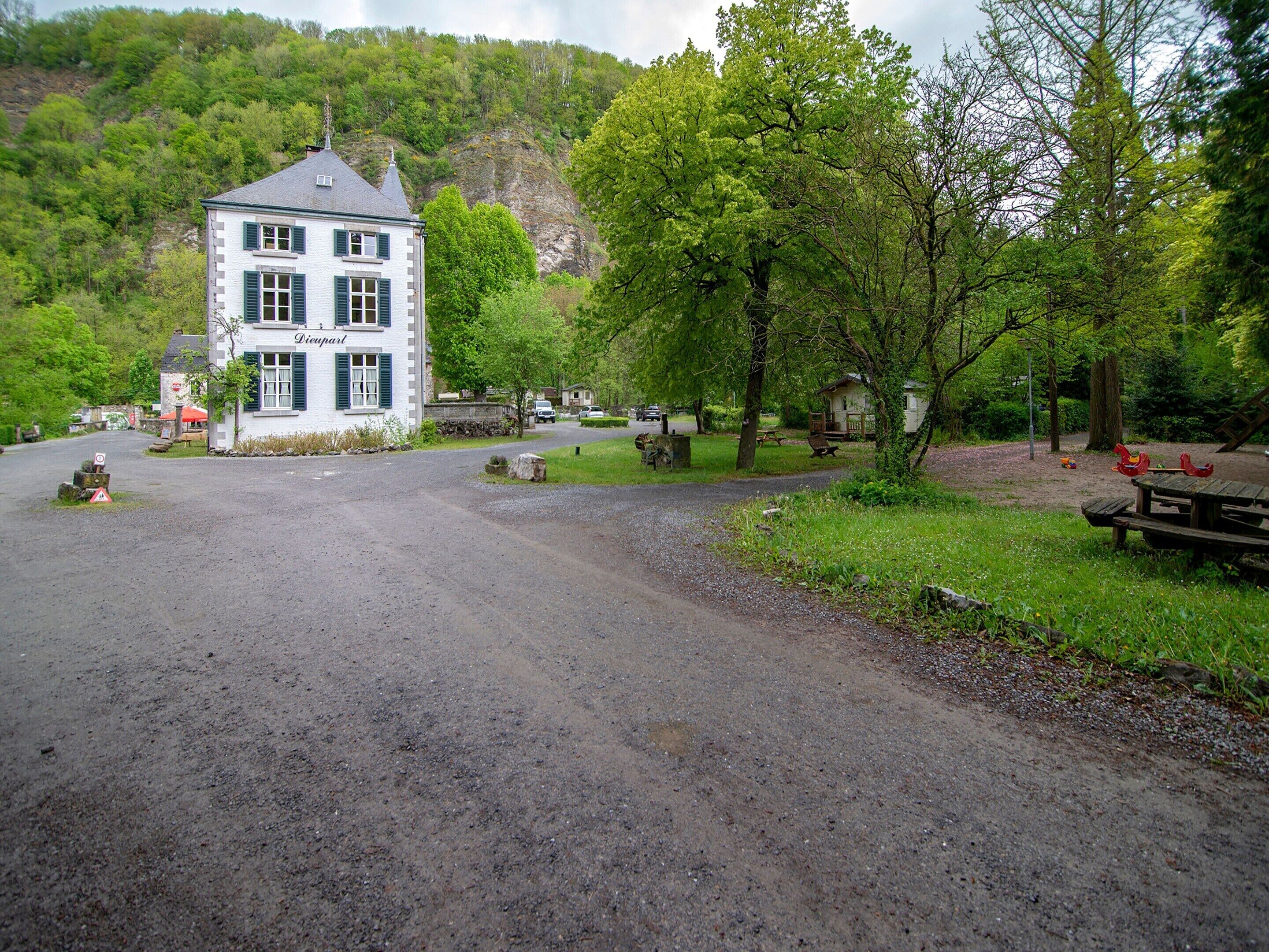 A two-story building with a sign reading "Domaine".