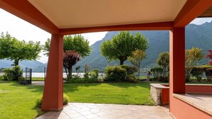 A covered patio with a view of a lake and mountains. - Villa by Lake Idro With Panoramic Views (Idro)