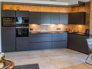 Coffee/tea maker, fridge, microwave, oven